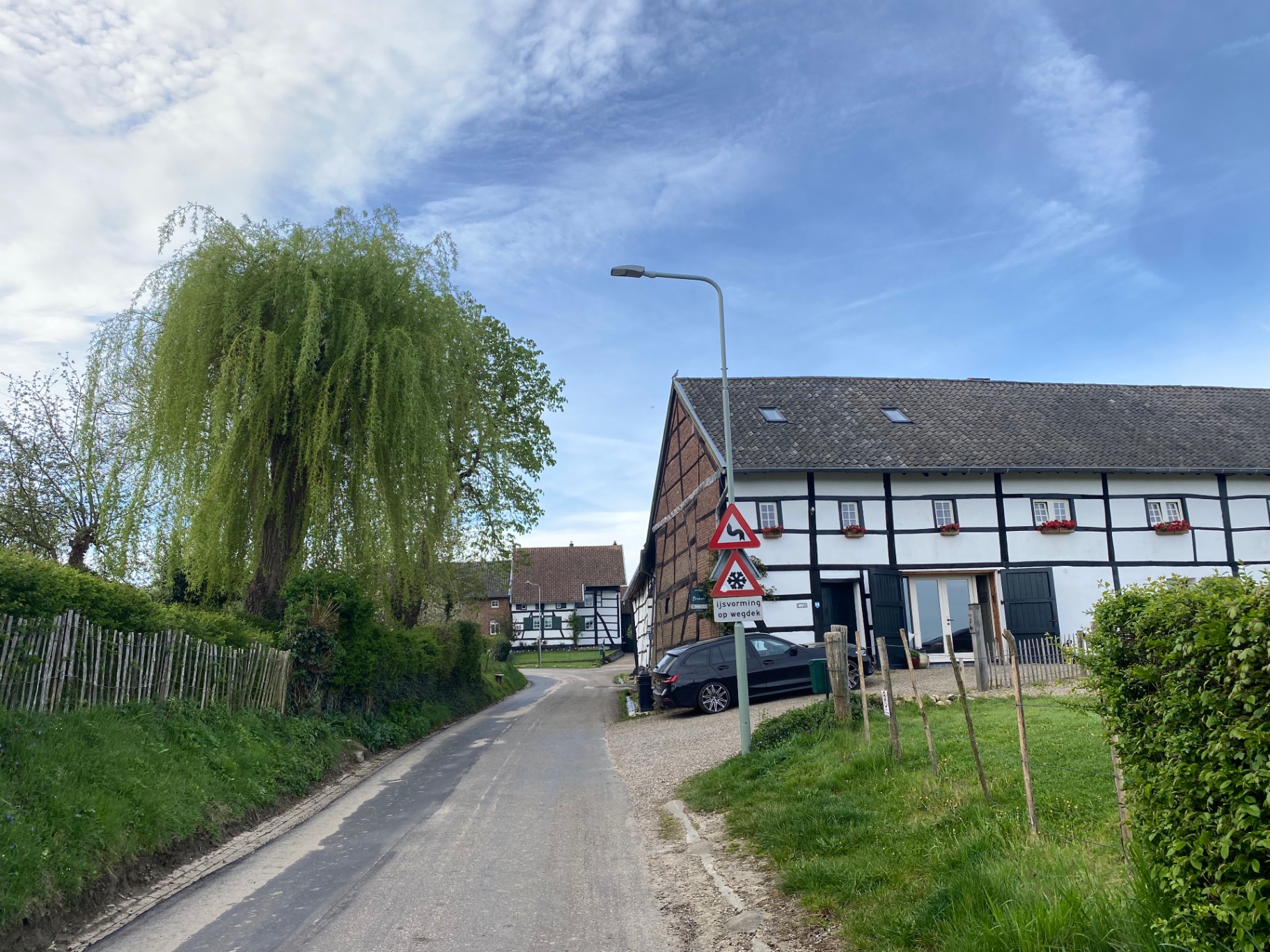 Half-timbered farmhouse along a quiet lane near Mechelen